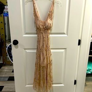 this is a great pageant/fun dress to wear it’s nude and has lots of sparkle!